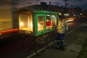 A street merchant at night in Hikkaduwa.