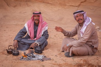 In the break the Bedouins Ataallah and Nayef quench their thirst with thyme-soaked tea.