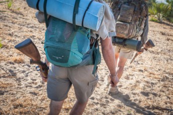 To protect against animal attacks, Lead Guide Bruce and Backup Guide Nep carry loaded rifles at all times.