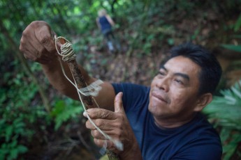 Amazon guide Samuel Basilio constructs camp equipment out of the rainforest's resources.