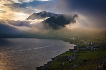 Evening view over the Bordoyarvík Fjord to Klaksvik, the midsummer light is absolutely magical. In the foreground on the right the village Nordoryi, whose roots go back to the Viking Age.
