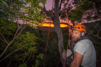 Like an abandoned chick in a nest, I sit on a branch at a height of 45 metres, while the sun says goodbye behind the green horizon (thanks to Leo Principe for the photo - and this amazing experience).