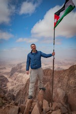 At the summit flag of Jordan's highest mountain - Um Al Dami.