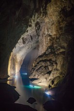 
From my point of view, I look 600 meters to the end of the Son Doong Cave. About 30 meters above the boats you can see a white veil: clouds! The cave has its own climate! From time to time we march through suddenly appearing 'steam baths', which then turn out to be clouds. At the end of the cave one would still have to climb the 200-meter-high, very slippery 'Great Wall of Vietnam' and then struggle through knee-deep mud to reach the back exit of the cave. Since this is definitely too dangerous and demanding, my cavemates and I paddle over the lake before we make the one-and-a-half-day march back to the entrance.