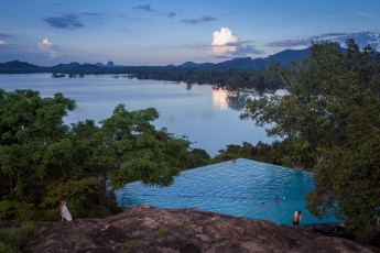 View from Heritance Kandalama Hotel over Lake Kandalama. The angular rock on the horizon is the famous Sigiriya Rock.