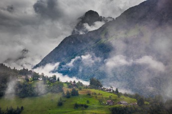 Low-hanging clouds push through the valleys, over the villages and past the forests to offer a completely new view just a few moments later.