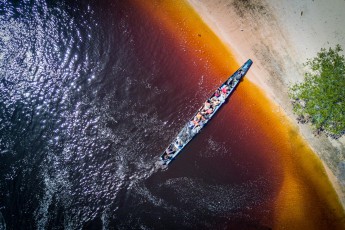 View of our boat. The colour of the river water comes from the many natural nutrients that are washed along.