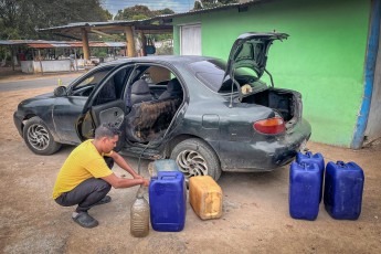 Many Venezuelans earn extra money by selling petrol.