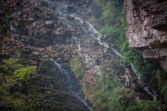 A very steep and slippery passage leads up to Roraima below a waterfall.