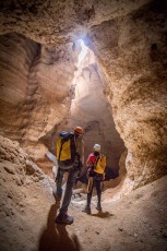 Hamid and Sukee look up about 200m to the ceiling crevice of the cave chamber called 'Cathedral'.