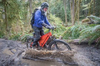 No cycle path for the inexperienced: with great skill and balance, environmentalist John Gussman dashes through large puddles. I prefer to push my bike around the outside.