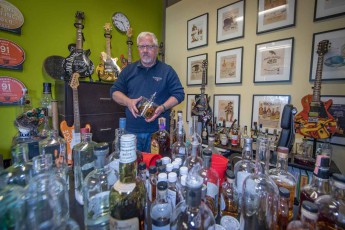 Keith Barnes, founder of Bainbridge Organic Whisky Distillery, in his study and whisky laboratory.