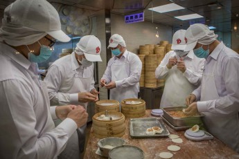 You can watch the 18 chefs and kitchen assistants at Din Tai Fung Restaurant as they prepare their famous xiaolongbaos, stuffed dumplings.