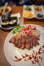 'Beef Tataki' combines the tender texture of beef with fresh cabbage, radishes, peppers, onions and an intense sauce flavour.