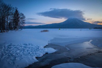 Early morning at Lake Akan. In the background, the 1,370 metre-high Mount Oakan stratovolcano.