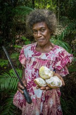 Marie Therese Ronneth shows us her freshly chopped coconuts on the island of Nguna.