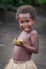 In the village of Imaio on the island of Tanna: Happy with the freshly prepared portion of laplap made from taro and coconut milk.